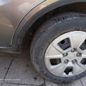 Self-adhesive protective rubber trim for car wheel arches