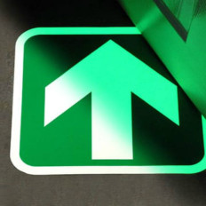 Phosphorescent adhesive arrow that glows in the dark for floors