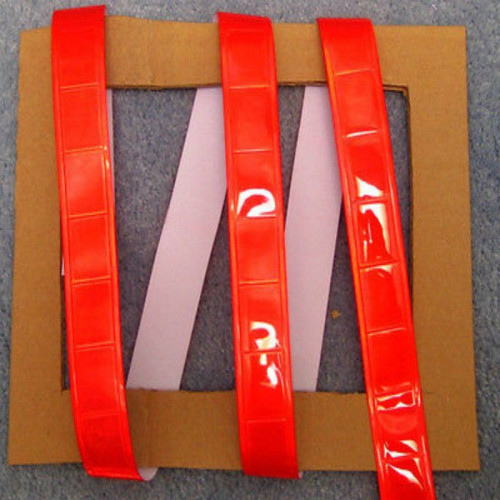High visibility fluorescent red reflective fabric sew on tape -