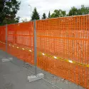 Construction site net for orange plastic fencing also for