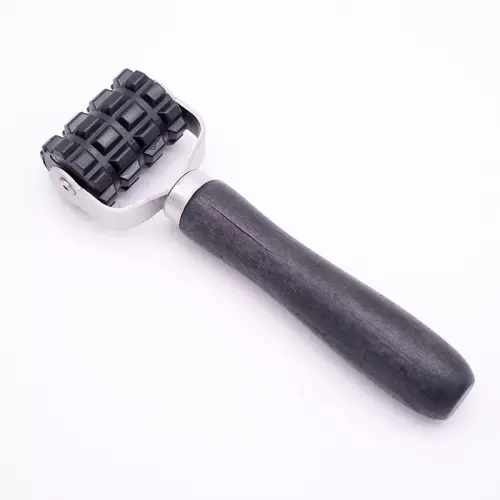 Rodillo de presión para aplicación de paneles fonoabsorbentes